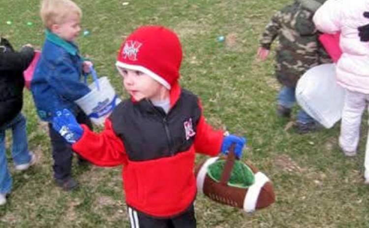 Three-year-old Kellen Peterson joins dozens of other kids in picking up Easter eggs on the courthouse lawn in the spring of 2009. The photo was snapped by his mom, Sunny Wendt, who remembers that as being one of the last Easter egg hunts held on the square.