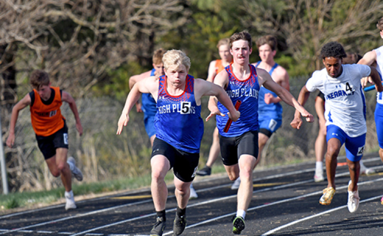 HPC’s Haden Helgoth hands off to fellow senior Gage Friesen for the anchor leg of the 400 relay at last week’s High Plains Invite. The Storm ended up second to Aquinas in a photo finish.