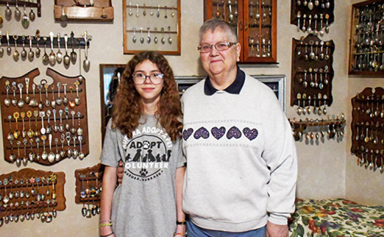 Nancy Wheeler (right) has spent 75 years of her life collecting spoons from around the country and the globe. She gets help maintaining the collection from her granddaughter, Gracie Wheeler-James (left).