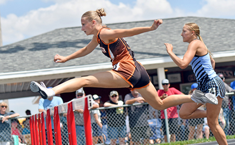 Jordan Margritz sails over one of the final hurdles during the 100 hurdle final in last week’s D-6 district meet at Sandy Creek. Margritz won the event with a new area-best time of 15.77.