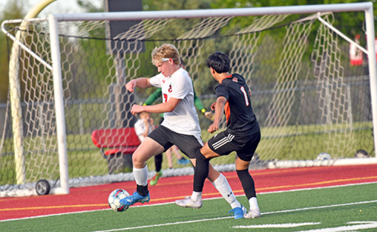 Aurora’s Garrett Kuehner (7) scored the team’s lone goal in Monday’s B-7 subdistrict loss to Hastings, ending the Huskies’ season.