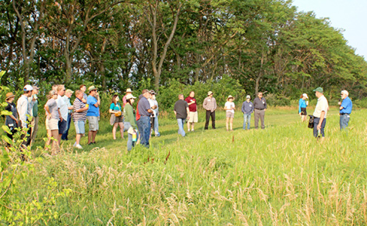 David Vetter (right), CEO of Grain Place Foods, leads visitors on a tour of the farm near Marquette during a previous field day. Morning farm tours will be also be a part of this year’s field day on July 12, but lunch and the afternoon session will be moved to The Leadership Center in Aurora for a presentation by Ray Archuleta, known nationally as “the Soil Guy,” and a screening of the film “Dreaming of a Vetter Life.”