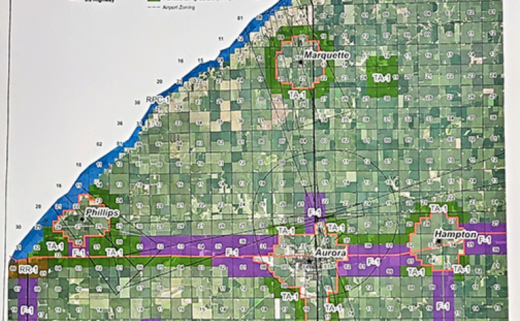 This photo of the large official county zoning map hanging in the Planning and Zoning office at the courthouse shows the various zoning districts in the county established by the 2019 Comprehensive Plan. The highest percentage of the land in the county is A-1 Agricultural Preservation District while the section marked F-1 along Highway 34 and part of Highway 14 is known as the Flex District.