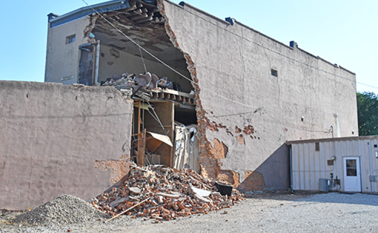 This photo of the former Gambles building was taken Saturday evening, shortly after a portion of the second story wall was captured on video falling to the ground.