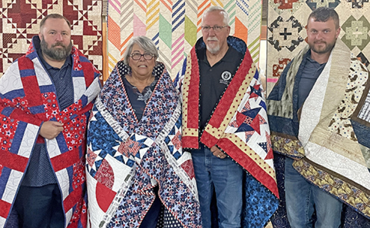 These veterans were honored by being presented with Quilts of Valor to recognize their service. From left to right: Matthew Vetter, Denise Winton, Ed Winton and Brad Dietz.
