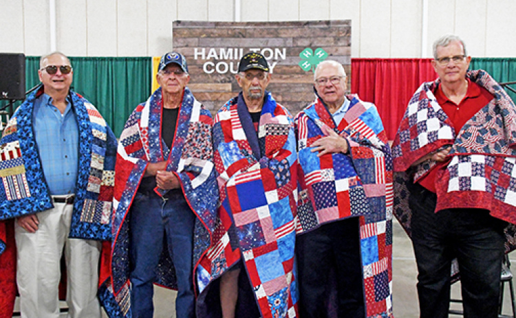 Five veterans were honored with Quilts of Valor in a ceremony hosted by the Hamilton County Thimble Quilt Guild at the Hamilton County Fairgrounds Sunday afternoon. Veterans who received their quilts includes from left: Marvin Weir, Larry Tournor, Dale Saddler, Jerald Reichert and Mike Powell.