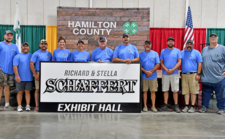 Hamilton County Ag Society member Richard Schaffert (center) was recognized for his service within the Ag Society and Hamilton County for more than 50 years on Thursday night at the opening ceremonies of the county fair. The fairgrounds Commercial Building was renamed the Richard & Stella Schaffert Exhibit Hall in their honor.