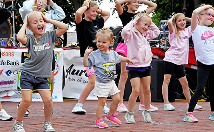 Kids dance to the music at one of the 2024 Bands on the Bricks Fridays.