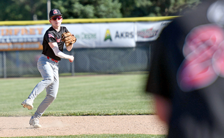 Aurora’s Mason Wiens fields a grounder at short and makes the throw to first during the Aurora Cooperative Juniors’ 10-1 win over Kearney July 1.