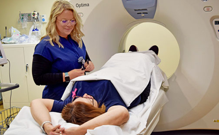 Jessica Prothman, MCHI radiologic technologist, demonstrates the coronary calcium CT testing now offered at Memorial Hospital.