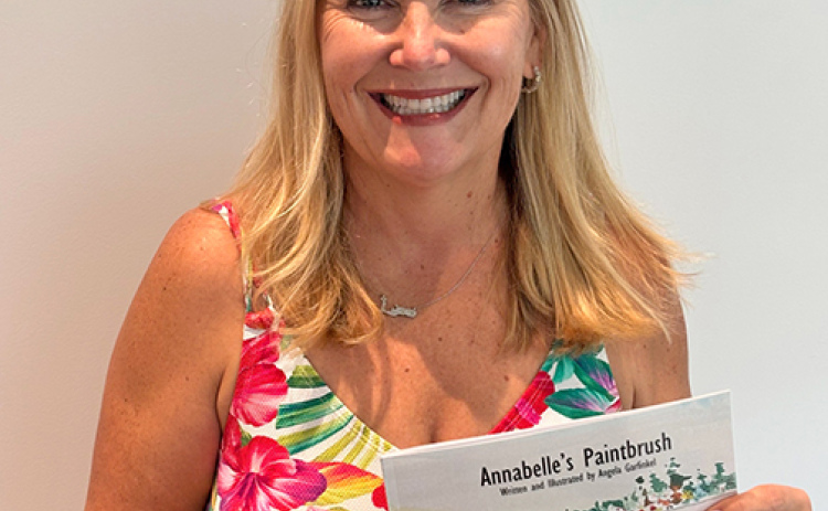 Former Aurora resident Angela Garfinkel has published her first children’s book, “Annabelle’s Paintbrush.” The book features Annabelle finding different items to use as a paintbrush with the story told in watercolor paintings created by Garfinkel.