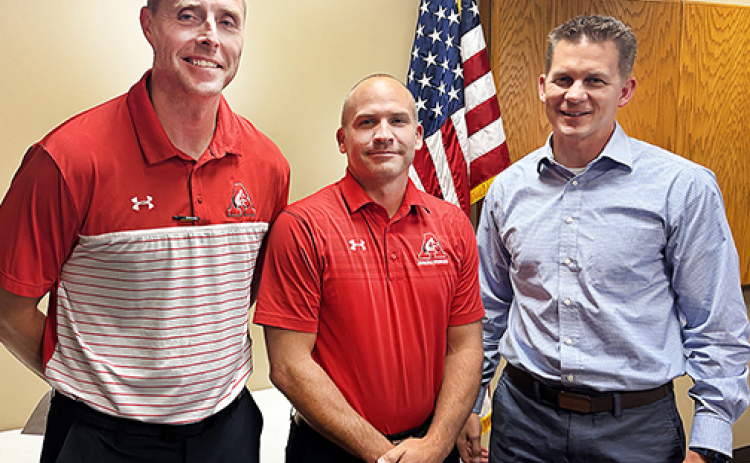 Pictured from left during a brief awards ceremony Aug. 11 are Jay Staehr, Cody Hoegh and Chad Carlson. Staehr received the Lifesaver Award from Emergency Health Systems of Nebraska for his quick action, which was credited for saving Hoegh’s life during a Feb. 5 heart attack at the school. Staehr and Carlson were also recognized by the Nebraska State Association of Athletic Trainers for their heroic actions.