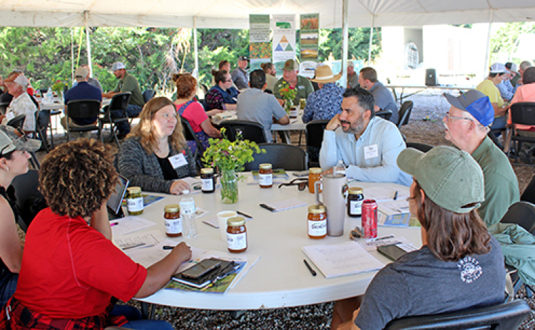 Participants in the Nebraska Soil Health Coalition’s (NSHC) first ever Soil Health Celebration of Learning near Bladen work on answering a questionnaire during the opening session of the event last Wednesday. The event brought together a diverse group of individuals from various sectors of the ag economy to celebrate the progress made by NSHC over the 20 months of its existence.