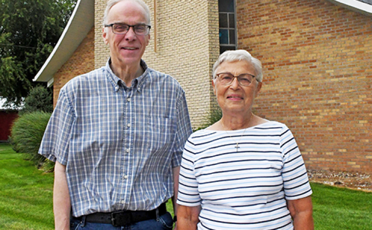 St. Peter’s Lutheran Church Pastor Dan Barbey and long-time church member Kathy Johnson stand outside the church building on H Street in Hampton. The church will hold its last Sunday morning worship service on Sept. 7.