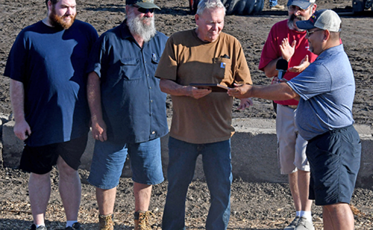 Three generations of the Marsh family were on hand to receive the Arsarben Pioneer Farm award presented by Hamilton County Ag Society president Justin Hermanson (right). From left are Matthew Marsh, his father Gayle (who currently operates the farm) and Gayle’s father, Ivan. Also pictured (back right) is Ag Society board member Jeremy Brandt.