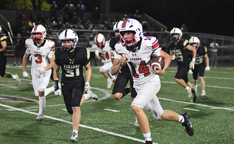 Aurora sophomore Sam Jones (14) made a pivotal play in the third quarter against Northwest, returning a kickoff to the Viking 22 after the Huskies had fallen behind 21-13. “Who would have thought he would be the kick returner that made such a big play,” coach Kyle Peterson said of Jones’ return. “I don’t think he’s probably ever returned a kick in his life, but what a spark for us.”