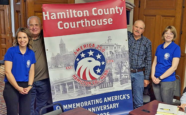 The Hamilton County Board of Commissioners was presented with an America 250 banner to be put on display in the county courthouse in preparation for the nation’s 250th birthday celebration in 2026. The presentation was made by members of the Hamilton County Nebraska Celebrate 250 Committee. Pictured from left are Jennifer Dennis, Commission Chairman Rich Nelson, Commissioner Francis McDonald and Kathryn Larson.