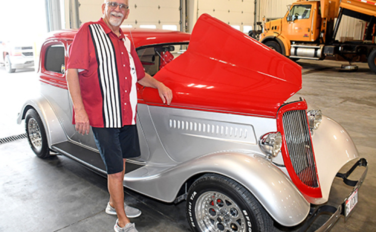 Randy Sabata proudly stands by “Miss Vicky,” a 1933 Ford Vicky which was sort of a retirement gift to himself. Sabata was honored for his 45-year career with the Nebraska Department of Roads/Transportation by more than 100 family, friends and colleagues during a reception Sept. 24.