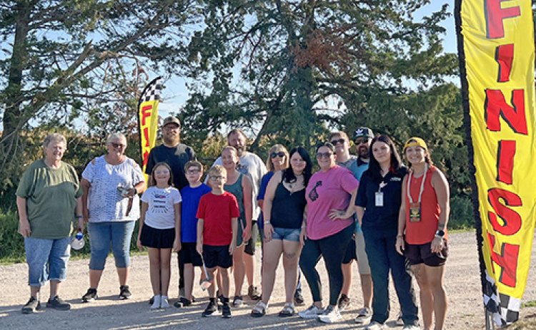 Greeting Gibson at the finish line were her family and friends who cheered and encouraged her as she completed a 50-mile run around Aurora.