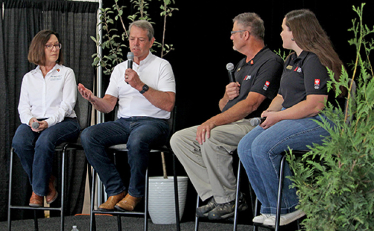 Gov. Jim Pillen speaks on Wednesday at Husker Harvest Days about his recent trade mission to Japan, the future of ag careers in Nebraska and his legislative priorities for next year. Pictured from left are State Ag Director Sherry Vinton, Pillen, Nebraska Farmer Senior Editor Curt Arens and staff writer Elizabeth Hodges.