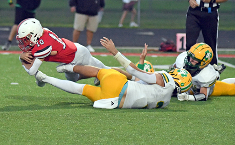 Aurora’s Ian Jensen gets that little bit of extra yardage, part of his 108 yards on 17 carries in the Huskies’ 41-21 win over Columbus Scotus Friday.