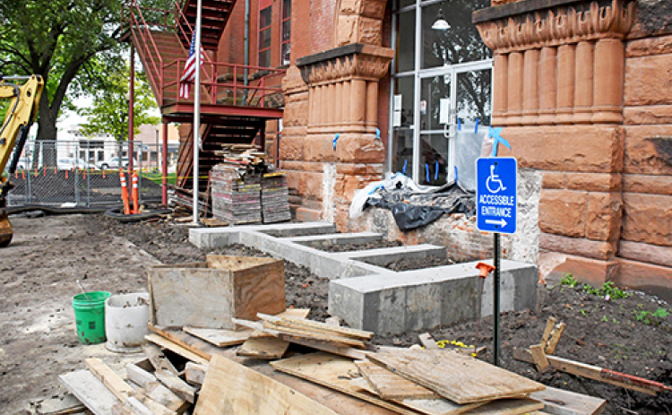 The concrete footings have been poured for the new eastside steps of the courthouse. This week workers plan to begin installing the bricks and granite blocks to build the steps.
