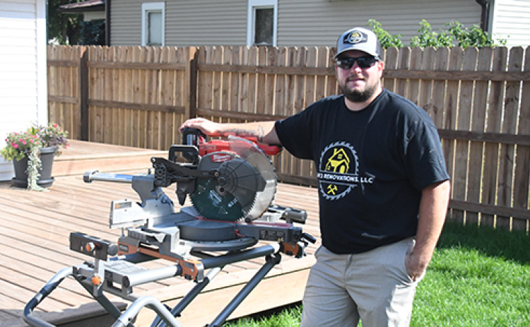 Heath Enderle Jr., who launched Eight-3 Renovations, LLC in June, displays  a deck in his own back yard as a sample of the type of home improvement projects he now offers.
