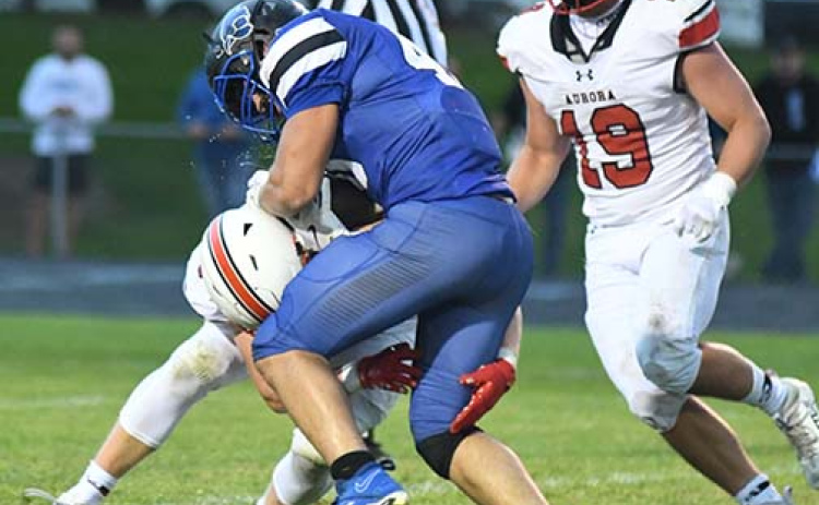 Garrett Kuehner goes low to bring down Pierce runningback Kaiden Fritz as teammate Collin Stolpe comes in to assist.
