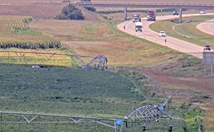 This image of the scene of an Aug. 26 fatal rollover crash on I-80 near Aurora was captured by a Nebraska 511 interstate traffic camera. The car can be seen on the left side of the photo beneath the irrigation pivot where it came to rest after leaving the roadway and rolling numerous times.