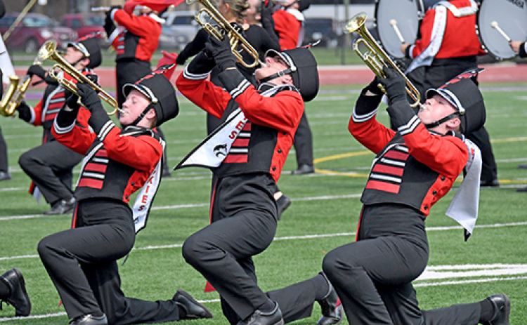 The Aurora Marching Huskies had another superior day at the 83rd annual Harvest of Harmony parade and field competitions. In addition to its Best Class A/B and first place Class B trophies, the band was the only Class B band to receive a Division I in the field competition. Performing in the field competition are trumpet players, from left: Ellie Brown, Ryan Benger and Ashlyn Yockey.