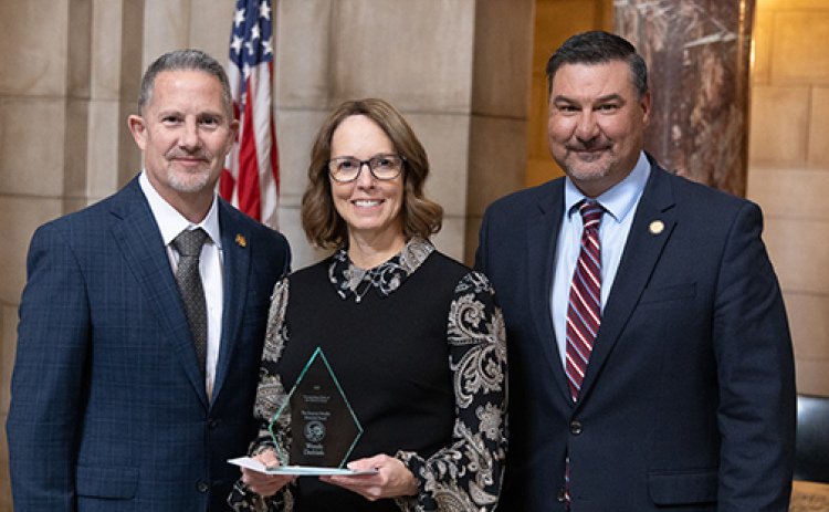 Hamilton County District Court Clerk Wendy Dethlefs (center) was presented with the  Marjorie Schaffer Memorial Award for Outstanding Clerk of the District Court for 2025 at a ceremony in Lincoln on Tuesday, Oct. 28. Pictured with her are Supreme Court Chief Justice Jeffrey Funke (left) and State Court Administrator Corey Steel.