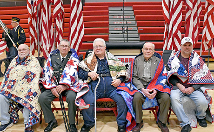 Pictured from left, Warren Anderson, Richard Carnes, Don Harvey, Oscar Lundquist and Travis Stevens received their quilts of valor during a Veteran’s Day program at AHS.