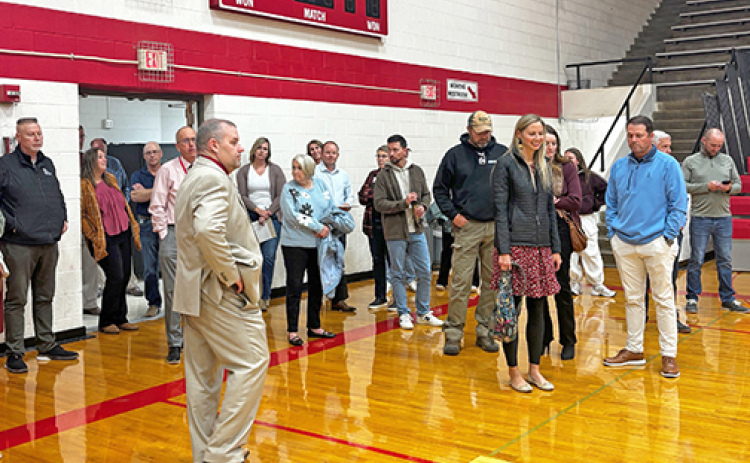 Aurora Supt. Jody Phillips leads a tour of the Aurora High School facilities Monday night during the first of several sessions planned with a newly formed community advisory committee.