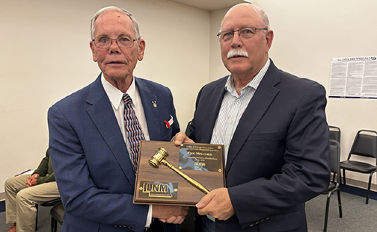 Former Aurora city administrator Rick Melcher was recognized during last week’s council meeting for his service on the League of Municipalities Nebraska City/County Managers Association, where he served the last year as president. Presenting the plaque is Mayor Marlin Seeman.