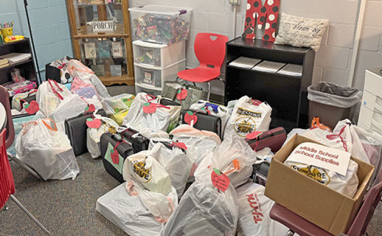 Paige McQuiston, the student and family liaison at Aurora Public Schools, focuses her time and effort on making food and various supplies available to local families in need.