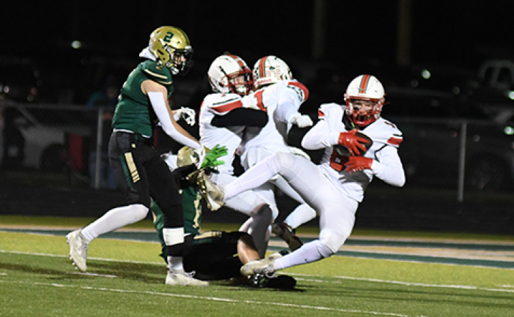 Husky senior Garrett Kuehner (8) came down with this third-quarter interception, ending a Bison threat in Aurora’s 42-21 playoff win.