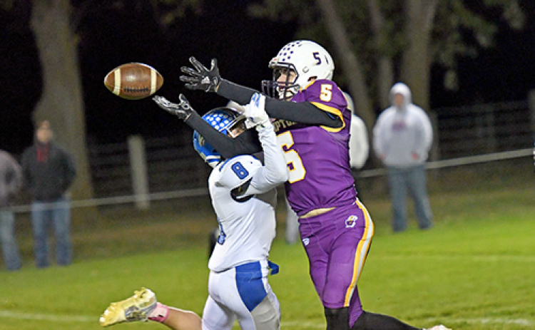 Brayden Wolinski fights through contact to try and haul in a pass.