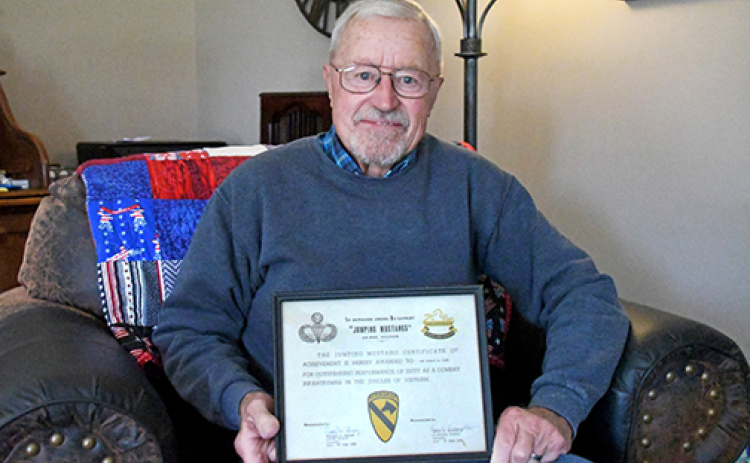 E-4 Specialist Ron Elge served in the U.S. Army from 1964-1966 during the Vietnam War. He worked in radio repair for his battalion while stationed at his base camp in An Khe. Elge displays his certificate that received after his service for being a parachute infantryman in the 1st Battalion (Airborne) 8th Cavalry.