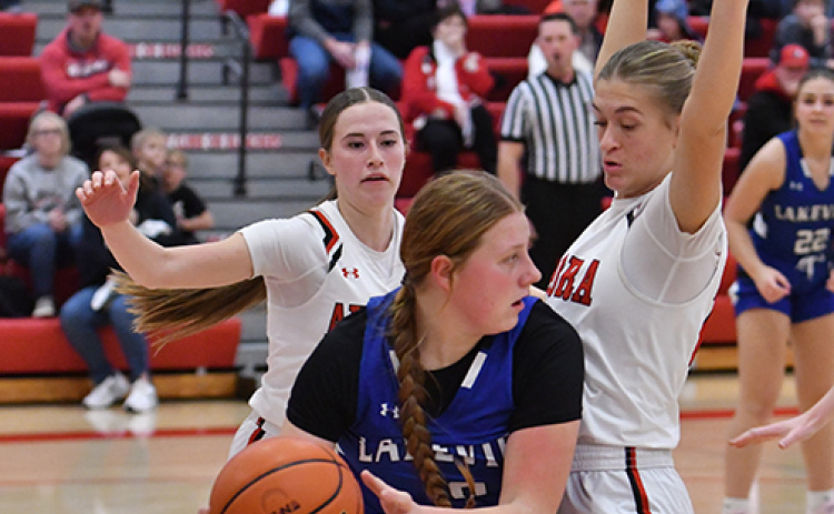 Maddie Ramaekers (right) and Hailey Hoff apply full-court pressure during early action Friday in the Lady Huskies 39-29 win over Columbus Lakeview.