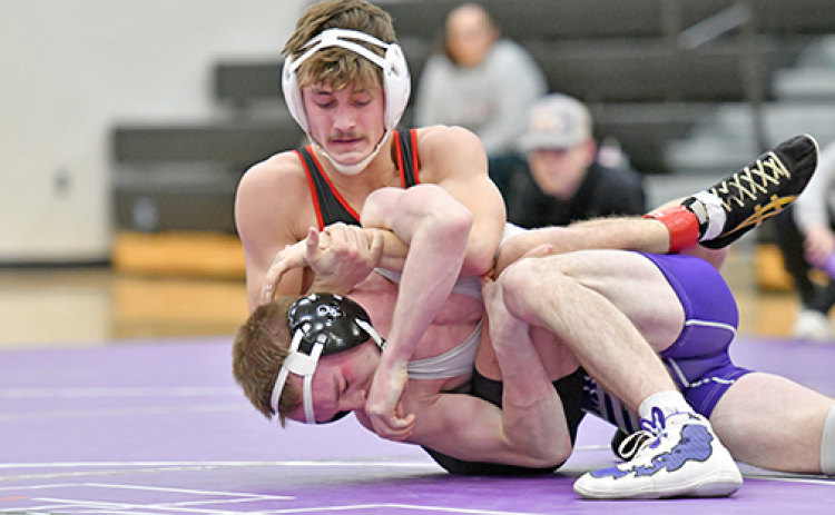 Aurora junior Logan Svoboda collected his 100th career win Friday in Platteview, adding to his currently unblemished 18-0 record this season. Svoboda is pictured above, wrestling up a weight class, defeating Minden’s Isaac Reed Thursday.