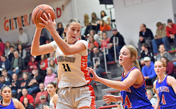 Giltner/Harvard’s Peyton Schutt (11) led the way with 20 points and eight rebounds during a 54-45 win at home over High Plains Friday. Schutt is shown here guarded by HPC’s Taya Hans.