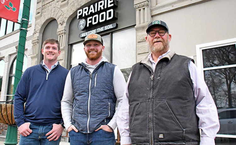 Prairie Food, a Kansas-based company focused on replenishing soil health while reducing synthetic inputs, opened a sales location earlier this month on the west side of the downtown square. Pictured from left are company representatives Pete Martin, Ben Vincent and Chris Vincent