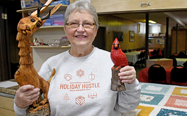St. John’s Lutheran Church member Opal Christensen shows some of the raffle prizes that will be offered during the church’s annual Aebleskiver feed on Sunday, Feb. 8.