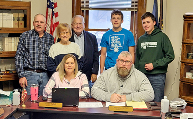 The Hamilton County Board of Commissions poses for a picture with two local 4-H club members following their proclamation Monday of February as 4-H Month. Seat from left are commissioners Nicole Sabell and Jessie Merkel. Standing are commissioners Francis McDonald, Nancy Salmon, Rich Nelson and 4-H members Boaz and Gideon Ochsner.