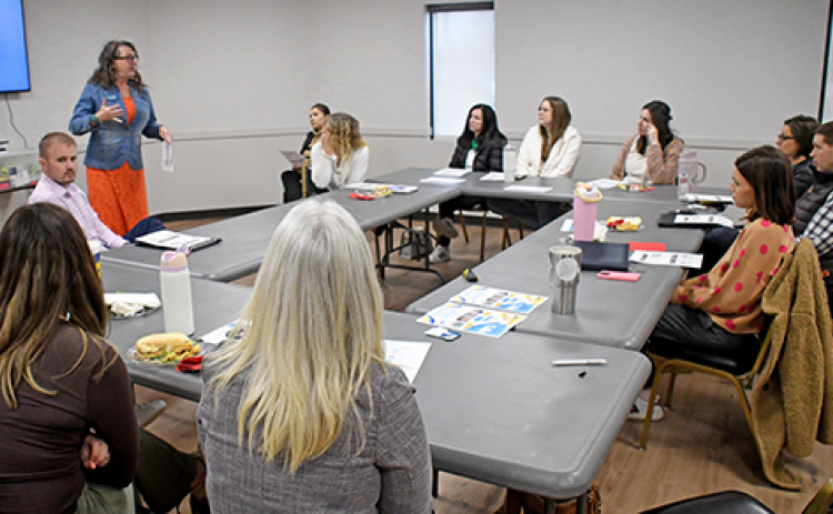 Dena Beck, Central Region Navigator for 6 Regions, One Nebraska, speaks to community members attending the Child Care Conversation hosted March 2 by the Aurora Chamber of Commerce. The lunchtime forum at the Bremer Center attracted more than 20 people to discuss ways to bolster child care options in the area for working families.