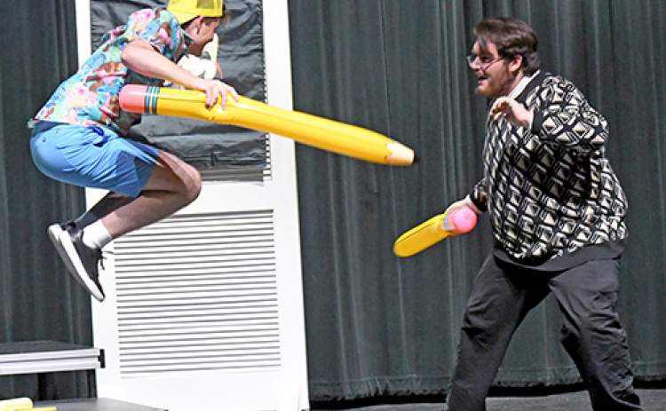 The Comedic Playwright, played by Trent Stevens (left) and the Tragic Playwright (Scott Bennett) dual with pencils as they fight for control over “Hydrangea Albright: Comedy or Tragedy?”