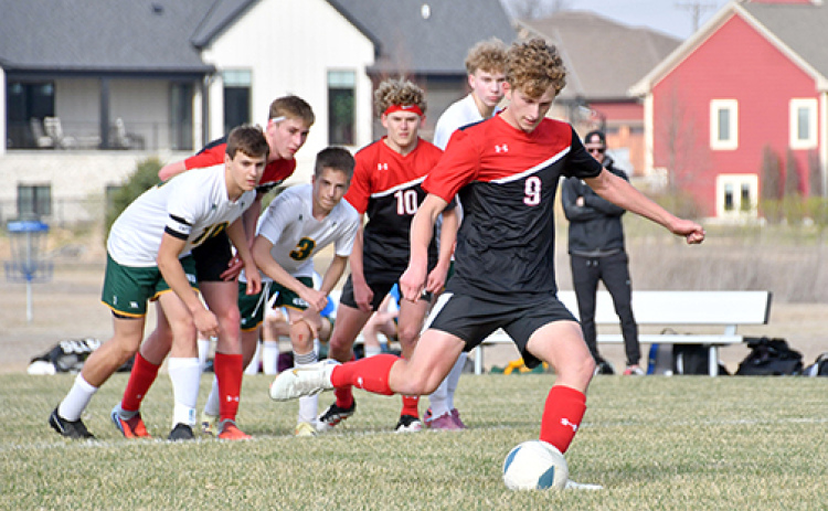 Aurora’s Alex Dick scored twice on penalty kicks to lift the Huskies in a 2-1 win over Kearney Catholic.