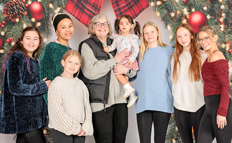 Karen (Bergen) Jackson (center) works as a NICU nurse and clinical educator at Children’s Minnesota Hospital in Minneapolis. Pictured with Jackson, are her seven granddaughters whom she calls the light of her life. From left are: Zoe, Izzy, Adalynn, Sloane, Annalyse, Amellia and Abbigail.