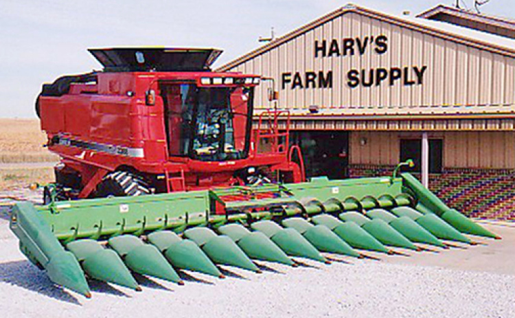A Case IH 2388 combine with a John Deere 1293 corn head is shown outside the Bish Enterprises shop in this photo from the late 1990s to early 2000s. (Bish Enterprises photo)