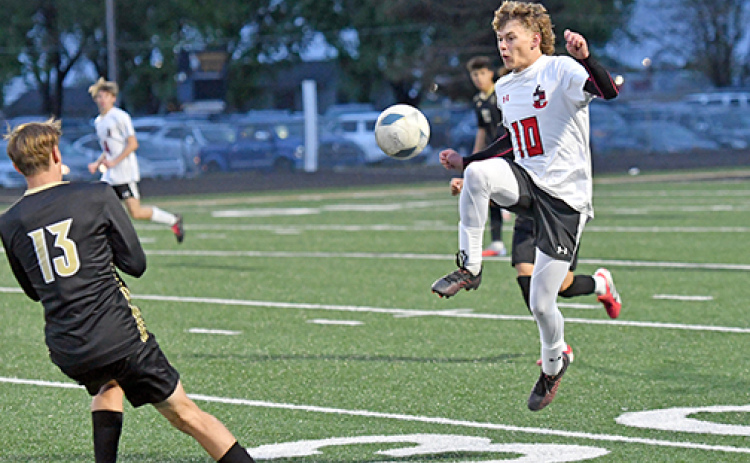 Aurora’s Ian Jensen makes quick work on his feet to move the ball downfield during the Huskies’ 6-2 loss at Northwest last week.